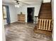 Spacious living room with hardwood floors and stairwell at 6593 N 800 W, Elwood, IN 46036