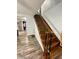 Hardwood steps leading upstairs with hardwood floors in hallway and kitchen at 6593 N 800 W, Elwood, IN 46036