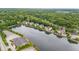 Expansive aerial shot showcasing lakeside condos with serene water views and lush green landscape at 6760 Spirit Lake Dr # 11, Indianapolis, IN 46220