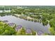 Stunning aerial view of lakeside apartments surrounded by lush greenery and tranquil water at 6760 Spirit Lake Dr # 11, Indianapolis, IN 46220