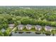 Scenic aerial shot of apartments nestled by a lake, providing a peaceful and picturesque setting at 6760 Spirit Lake Dr # 11, Indianapolis, IN 46220