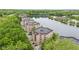 Picturesque aerial shot of lakeside apartment complex with mature trees and scenic waterfront views at 6760 Spirit Lake Dr # 11, Indianapolis, IN 46220