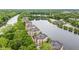 Aerial view showcasing apartments along a river with lush greenery offering a serene living environment at 6760 Spirit Lake Dr # 11, Indianapolis, IN 46220