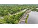 Aerial view showcasing apartments along a river with lush greenery offering a serene living environment at 6760 Spirit Lake Dr # 11, Indianapolis, IN 46220