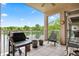 Relaxing balcony with a grill and tranquil lake view for outdoor enjoyment at 6760 Spirit Lake Dr # 11, Indianapolis, IN 46220