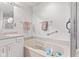 Bathroom with a tiled shower, soaker tub, and neutral walls and vanity at 6760 Spirit Lake Dr # 11, Indianapolis, IN 46220