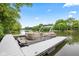 Pontoon boat docked on the lake, surrounded by lush greenery, perfect for leisure outings at 6760 Spirit Lake Dr # 11, Indianapolis, IN 46220