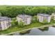 Lakeside condo buildings nestled in a green landscape, offering peaceful and picturesque scenery at 6760 Spirit Lake Dr # 11, Indianapolis, IN 46220