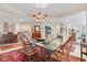 Bright dining area with a glass table, traditional seating, and open floor plan at 6760 Spirit Lake Dr # 11, Indianapolis, IN 46220