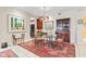 Charming dining room with a glass-top table, wood chairs, and a decorative rug at 6760 Spirit Lake Dr # 11, Indianapolis, IN 46220