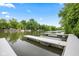 Docks and tranquil lake view amidst lush greenery, perfect for boating and nature enthusiasts at 6760 Spirit Lake Dr # 11, Indianapolis, IN 46220