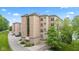 Exterior view of a multi-story residential building with well-maintained landscaping and parking area at 6760 Spirit Lake Dr # 11, Indianapolis, IN 46220