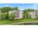 Elegant condo exterior with balconies and manicured lawn, providing a scenic waterfront view at 6760 Spirit Lake Dr # 11, Indianapolis, IN 46220