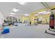 Spacious gym featuring modern exercise equipment, natural light, and ample room for workouts at 6760 Spirit Lake Dr # 11, Indianapolis, IN 46220