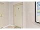 Entryway to home featuring tile flooring, neutral walls, and door with decorative mat at 6760 Spirit Lake Dr # 11, Indianapolis, IN 46220