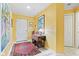 Hallway view featuring neutral walls, accent table, overhead lighting and artwork at 6760 Spirit Lake Dr # 11, Indianapolis, IN 46220