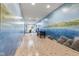 Hallway featuring ocean mural, tiled floors, bench, and table at 6760 Spirit Lake Dr # 11, Indianapolis, IN 46220
