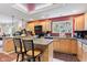 Spacious kitchen with natural wood cabinets, skylight, and open layout perfect for entertaining at 6760 Spirit Lake Dr # 11, Indianapolis, IN 46220