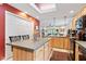 Functional kitchen island features a breakfast bar, ample storage, and seamless flow into the living area at 6760 Spirit Lake Dr # 11, Indianapolis, IN 46220