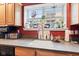 Close-up of well-organized kitchen sink area with stainless steel appliances and natural light at 6760 Spirit Lake Dr # 11, Indianapolis, IN 46220