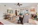 Inviting living room featuring stylish seating, a ceiling fan, and an outdoor view at 6760 Spirit Lake Dr # 11, Indianapolis, IN 46220