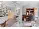 Cozy living room featuring custom shelving, comfortable seating, and a decorative glass table at 6760 Spirit Lake Dr # 11, Indianapolis, IN 46220
