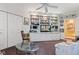 Spacious living room with built-in shelving, a glass coffee table, and plenty of natural light at 6760 Spirit Lake Dr # 11, Indianapolis, IN 46220