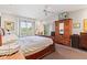 Spacious main bedroom featuring a ceiling fan, ensuite, and plenty of natural light at 6760 Spirit Lake Dr # 11, Indianapolis, IN 46220