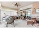 Enclosed sunroom featuring comfortable seating, ceiling fan, and an inviting atmosphere at 6760 Spirit Lake Dr # 11, Indianapolis, IN 46220