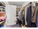 Bright walk-in closet with shelving, hanging space, carpet and a white door at 6760 Spirit Lake Dr # 11, Indianapolis, IN 46220