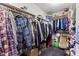 Walk-in closet with many hanging clothes, shelving for storage, and carpet at 6760 Spirit Lake Dr # 11, Indianapolis, IN 46220
