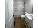 Clean bathroom with a shower-tub combination, modern vanity, and neutral finishes at 6845 Arjay Dr, Indianapolis, IN 46217