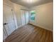 Bedroom featuring a window, closet, and hardwood floors, creating a simple, functional space at 6845 Arjay Dr, Indianapolis, IN 46217