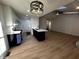Stylish kitchen featuring an island, modern lighting, and seamless flow into the living area at 6845 Arjay Dr, Indianapolis, IN 46217