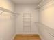Walk-in closet featuring wood floors and metal racks for optimal storage at 6845 Arjay Dr, Indianapolis, IN 46217