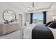 Comfortable bedroom with a tray ceiling, dresser and a large window at 6851 Jacone Dr, Brownsburg, IN 46112