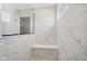 Stylish shower with white marble style tile, a glass enclosure, and a built-in bench at 6851 Jacone Dr, Brownsburg, IN 46112