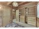Bedroom with closet, wood walls, and chandelier at 6937 Muskrat Dr, , IN 46164