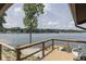 Enjoy breathtaking water views from this wooden deck, perfect for relaxing by the lake at 6937 Muskrat Dr, , IN 46164