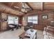 Dining area with rustic wood table, cozy seating, and serene lake views at 6937 Muskrat Dr, , IN 46164