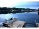 Pontoon boat on a lake, showcasing scenic waterfront views and boat dock at 6937 Muskrat Dr, , IN 46164