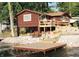 Lake house featuring a spacious deck, dock and waterfront access at 6937 Muskrat Dr, , IN 46164