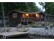 Cozy cabin with waterfront access, wooden decks, and landscaping for peaceful lake living and relaxing outdoors at 6937 Muskrat Dr, , IN 46164
