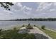 Lakeside fire pit with a tranquil water view, perfect for cozy gatherings and serene evenings at 6937 Muskrat Dr, , IN 46164