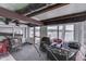 Enclosed lake room featuring lake views, casual seating, and access to the outdoors at 6937 Muskrat Dr, , IN 46164
