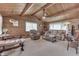 Inviting living room with vaulted wood ceilings, a ceiling fan, and comfortable seating at 6937 Muskrat Dr, , IN 46164