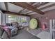 Storage room with lake equipment, lawnmower, and chairs at 6937 Muskrat Dr, , IN 46164