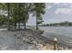 Scenic lake view with a peaceful hammock, picnic table and rock shoreline to enjoy the outdoors at 6937 Muskrat Dr, , IN 46164