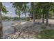 Picturesque lakefront yard with a dock, cabin, and hammock, ideal for relaxing waterfront living at 6937 Muskrat Dr, , IN 46164