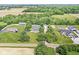A captivating aerial perspective of a home reveals its harmonious integration with the surrounding landscape at 7221 State Road 42, Martinsville, IN 46151